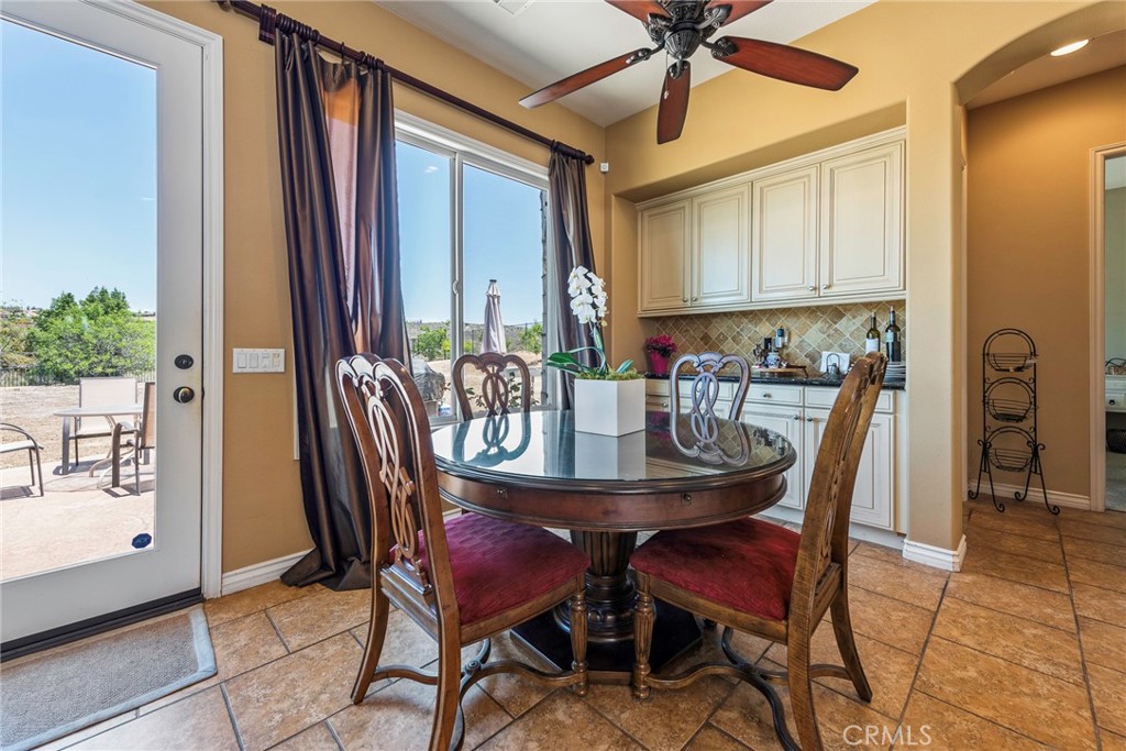 7940 Choi Drive Riverside, CA 92506 - Photo 22 of 56 a view of a dining room with furniture and a chandelier