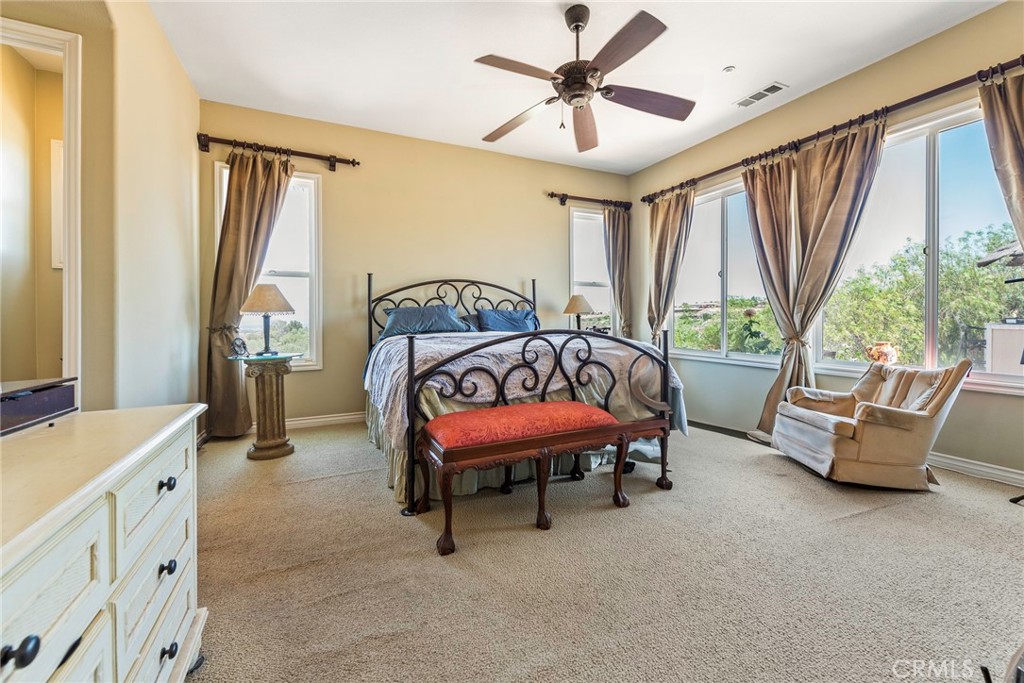 7940 Choi Drive Riverside, CA 92506 - Photo 31 of 56 a bedroom with furniture and a window