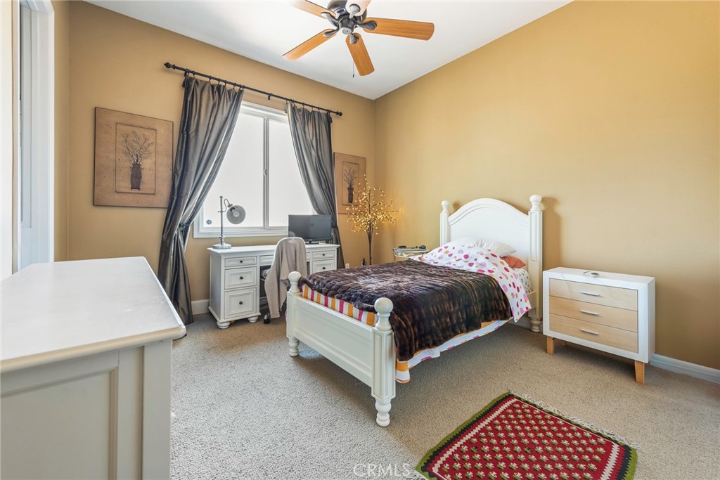 7940 Choi Drive Riverside, CA 92506 - Photo 40 of 56 a bedroom with a bed and a table