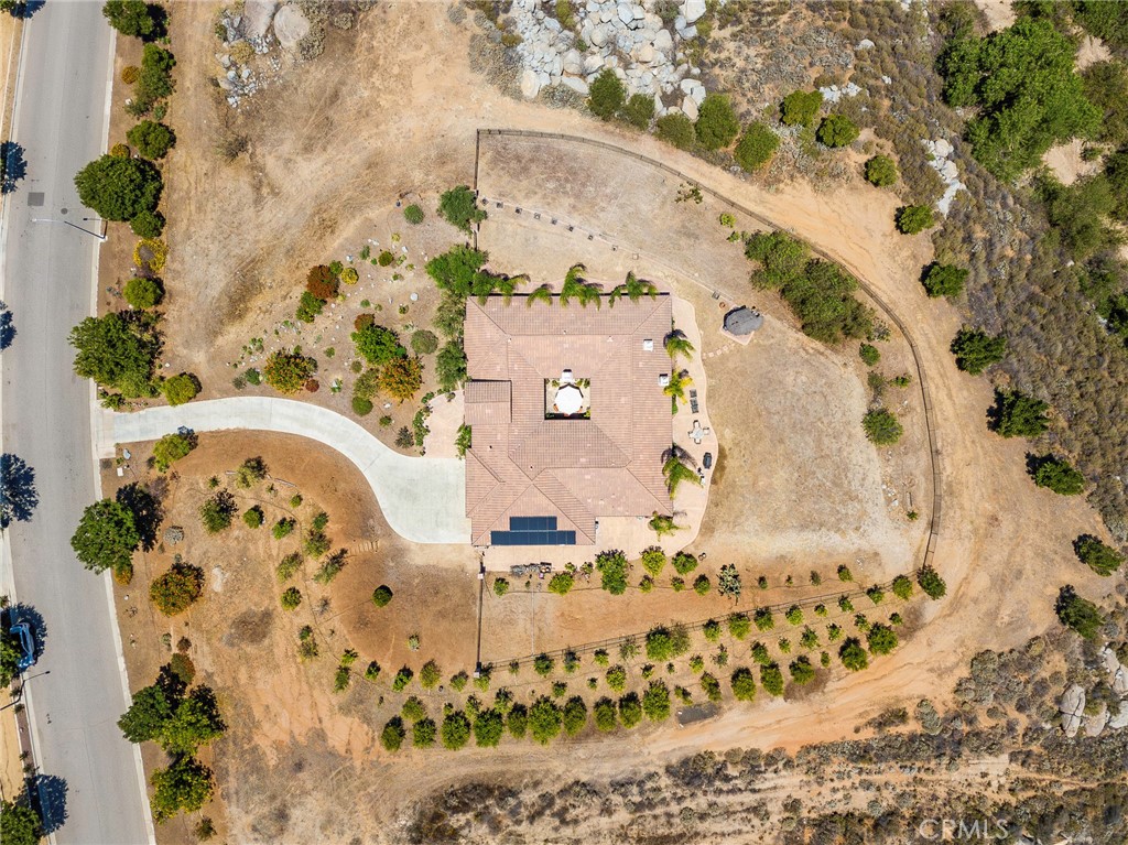 7940 Choi Drive Riverside, CA 92506 - Photo 5 of 56 an aerial view of a house with a yard and large trees