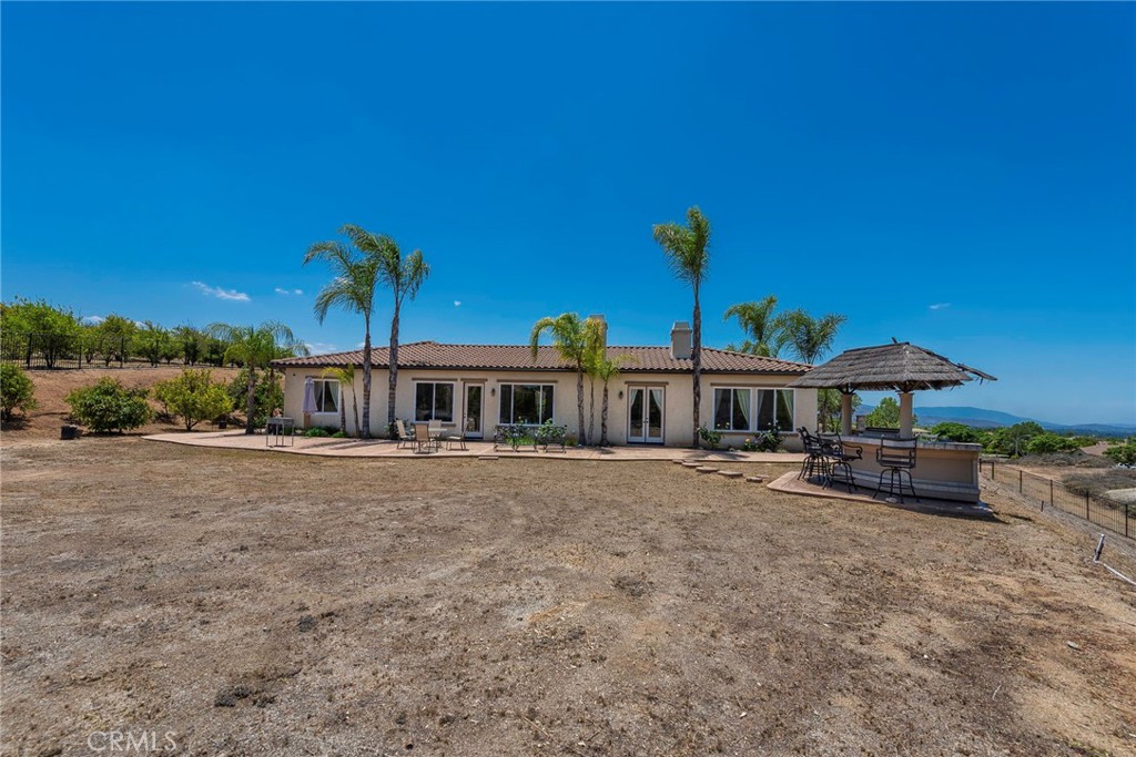 7940 Choi Drive Riverside, CA 92506 - Photo 52 of 56 a view of a house with a backyard