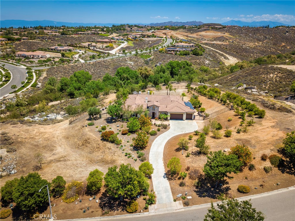 7940 Choi Drive Riverside, CA 92506 - Photo 6 of 56 an aerial view of residential house with yard and mountain view in back