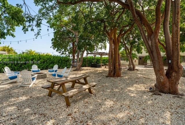 325 Calusa Street, Unit 118 Key Largo, FL 33037 - Photo 11 of 18 a view of a backyard with a patio and outdoor seating
