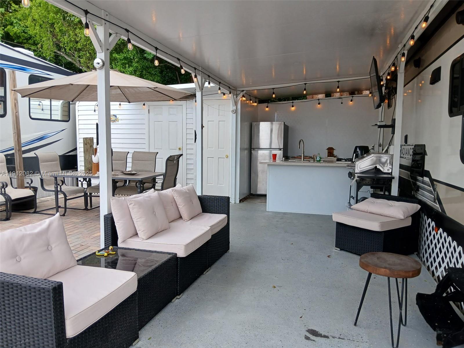 325 Calusa Street, Unit 118 Key Largo, FL 33037 - Photo 4 of 18 a living room with furniture and a large window