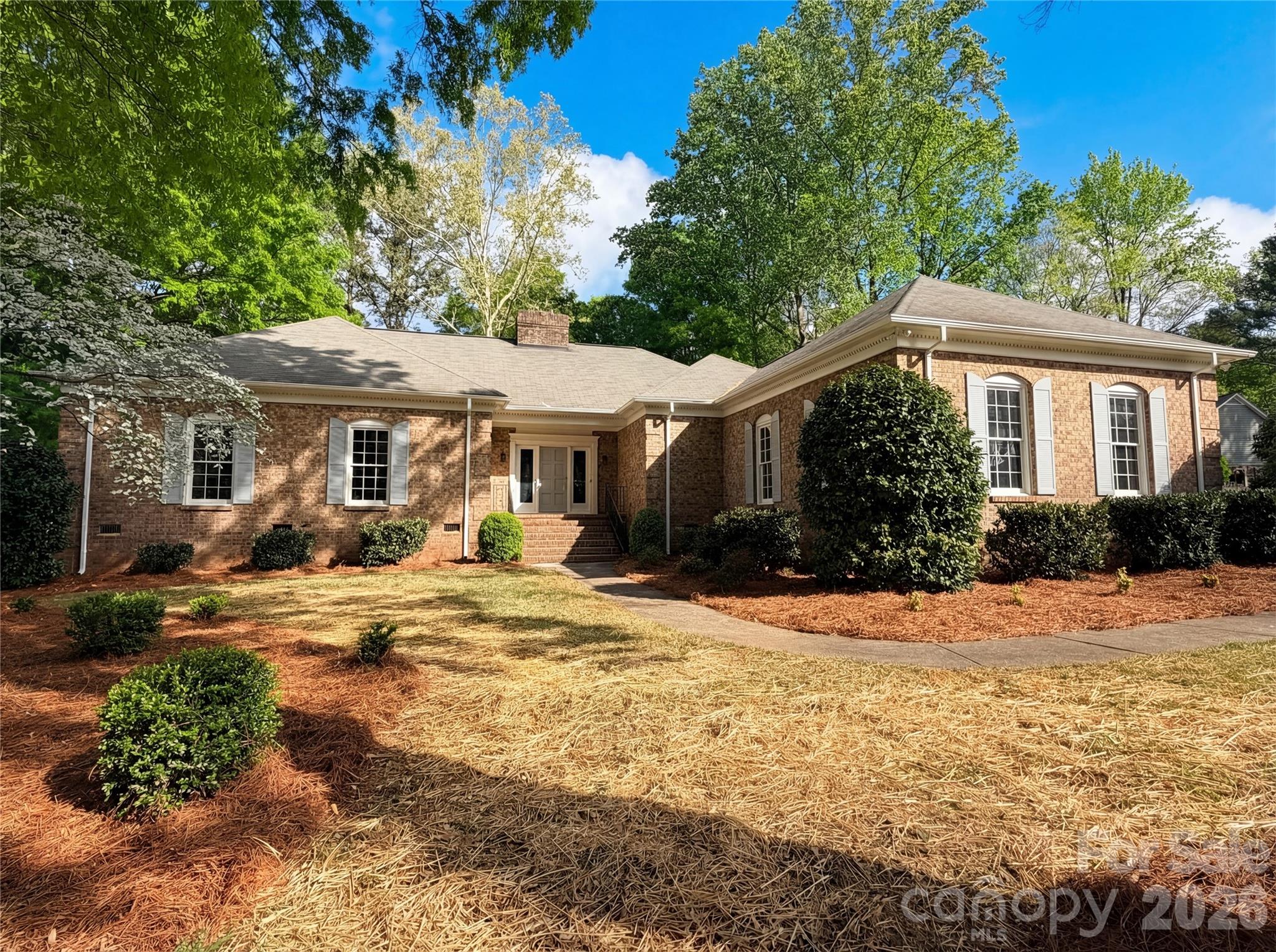 6024 Dovefield Road Charlotte, NC 28277 - Photo 1 of 17 a front view of a house with a yard