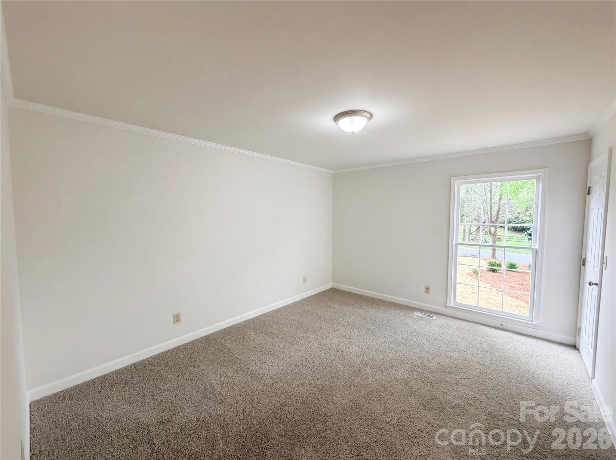 6024 Dovefield Road Charlotte, NC 28277 - Photo 11 of 17 an empty room with windows