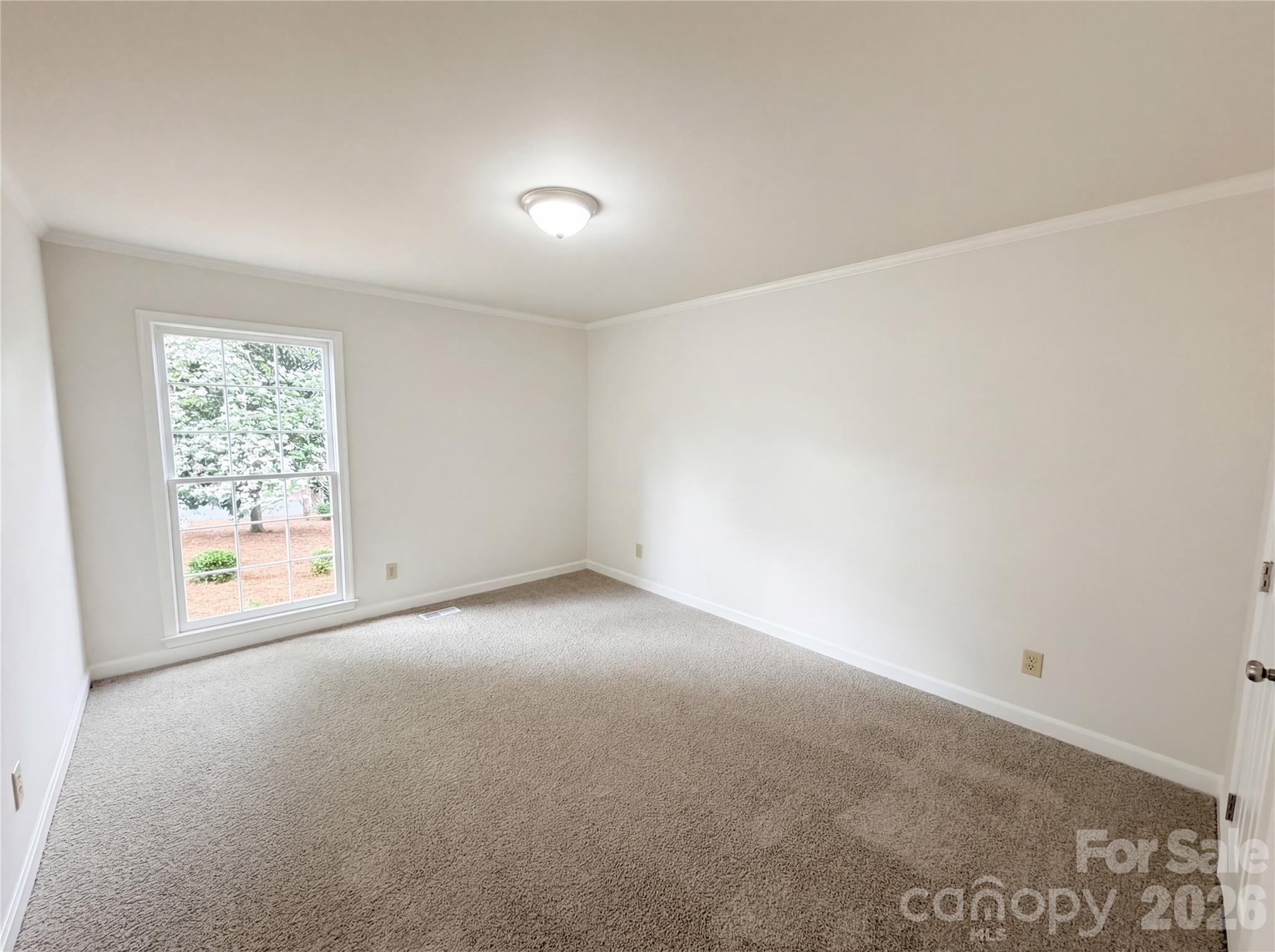 6024 Dovefield Road Charlotte, NC 28277 - Photo 12 of 17 an empty room with windows