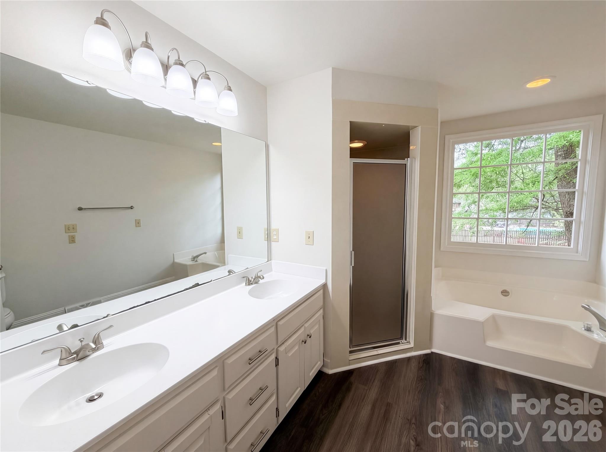 6024 Dovefield Road Charlotte, NC 28277 - Photo 13 of 17 a spacious bathroom with a double vanity sink and a mirror