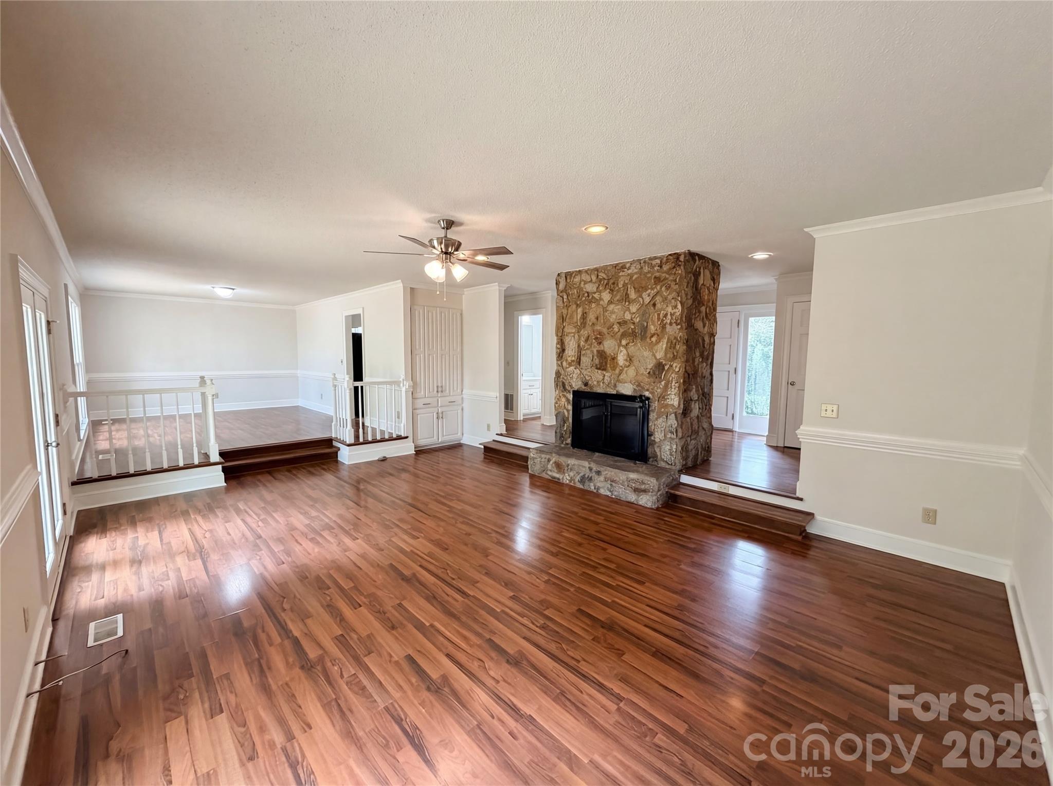 6024 Dovefield Road Charlotte, NC 28277 - Photo 5 of 17 a view of empty room with wooden floor and window