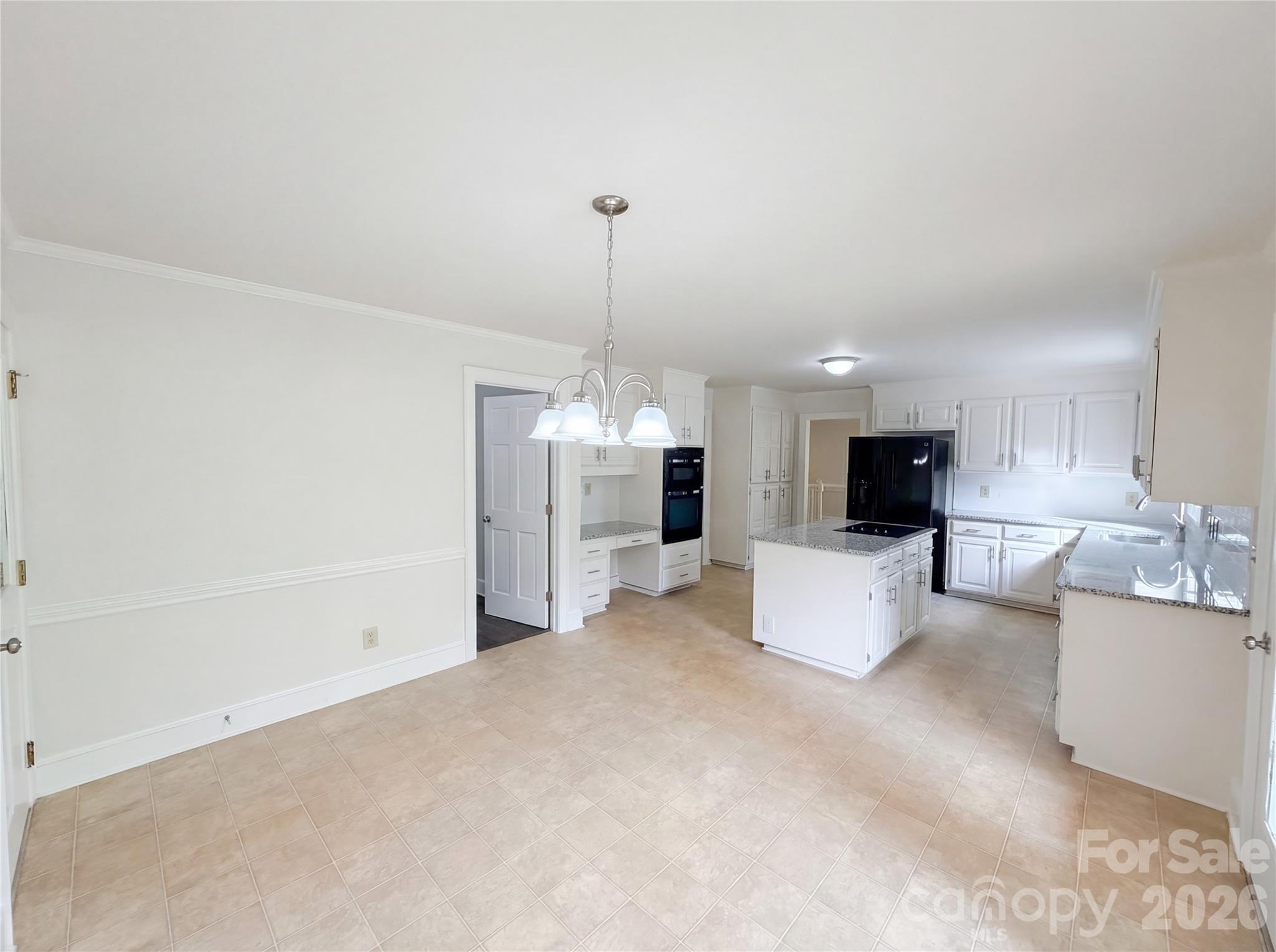 6024 Dovefield Road Charlotte, NC 28277 - Photo 7 of 17 a living room with furniture a flat screen tv and a chandelier