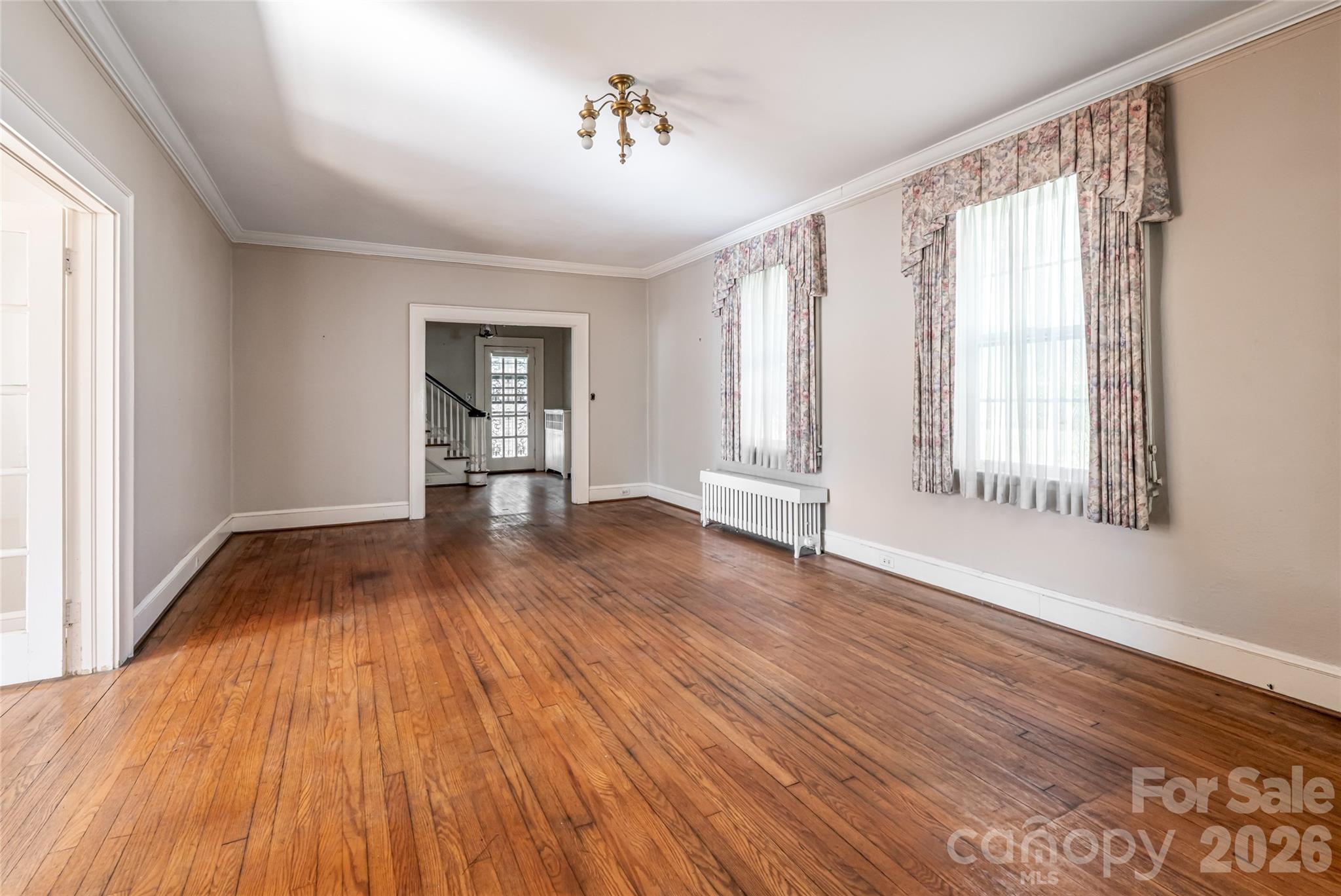 325 Vanderbilt Road Asheville, NC 28803 - Photo 13 of 48 a view of empty room with wooden floor and fan