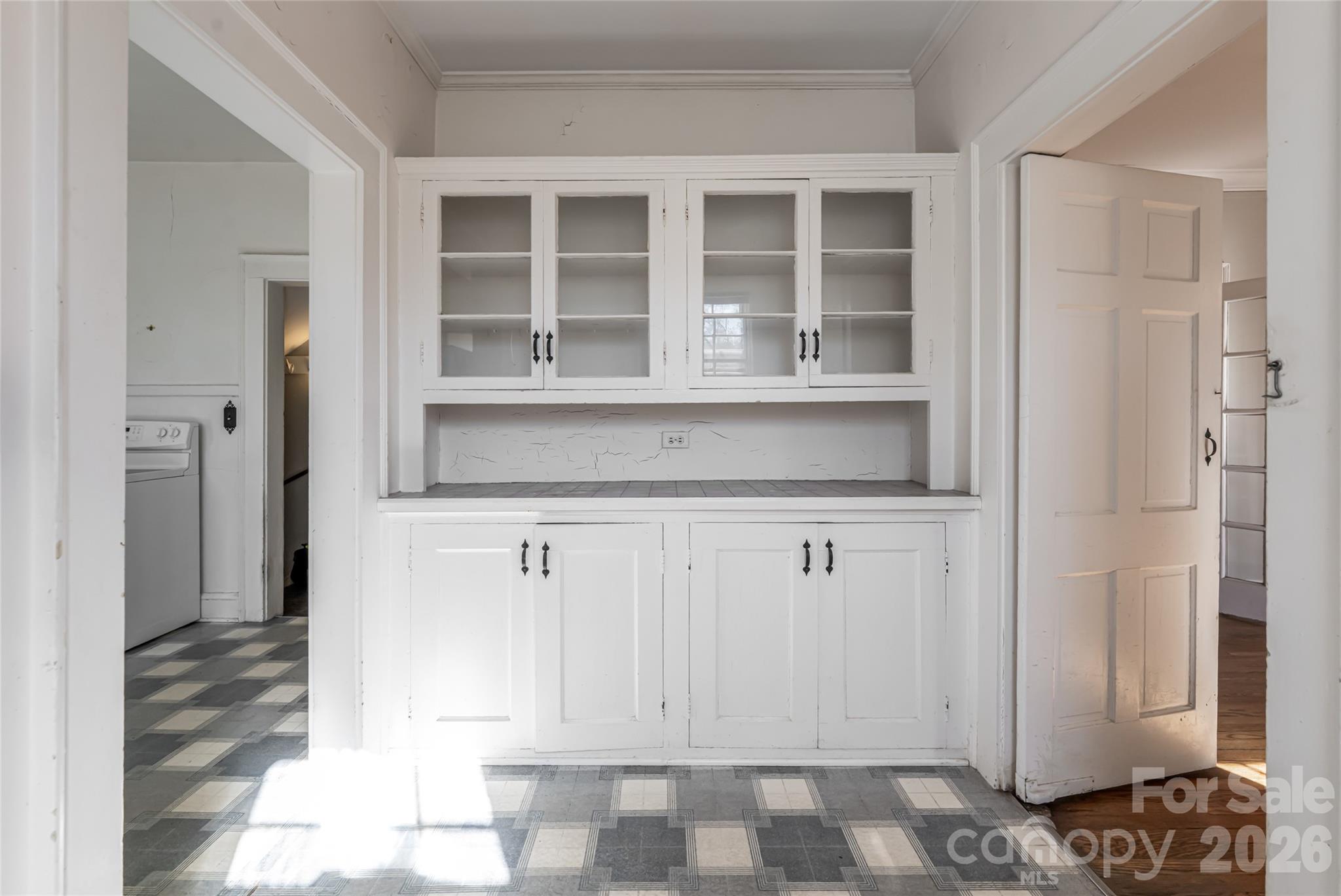 325 Vanderbilt Road Asheville, NC 28803 - Photo 18 of 48 a kitchen with white cabinets and a refrigerator