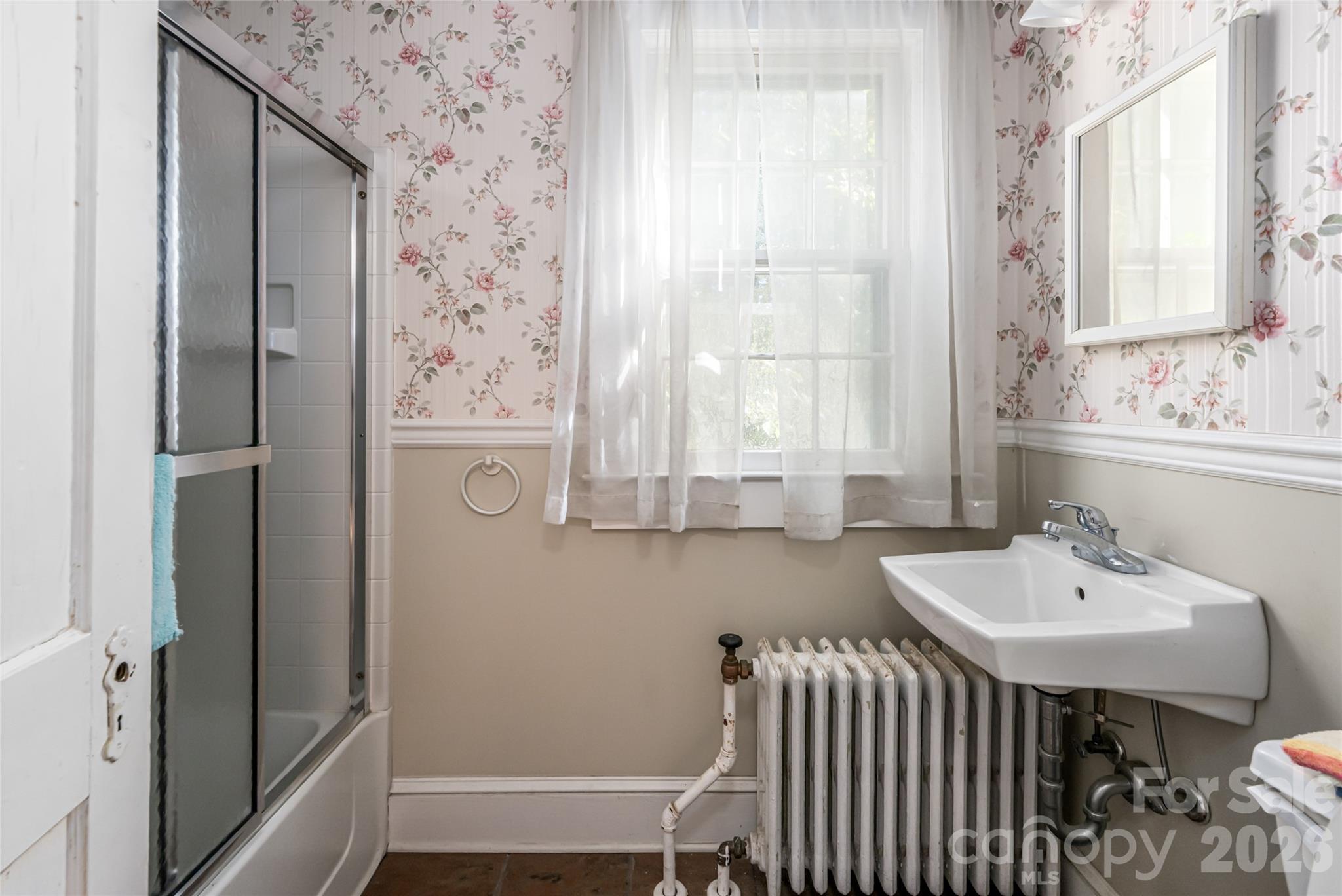 325 Vanderbilt Road Asheville, NC 28803 - Photo 26 of 48 a bathroom with a sink and a mirror