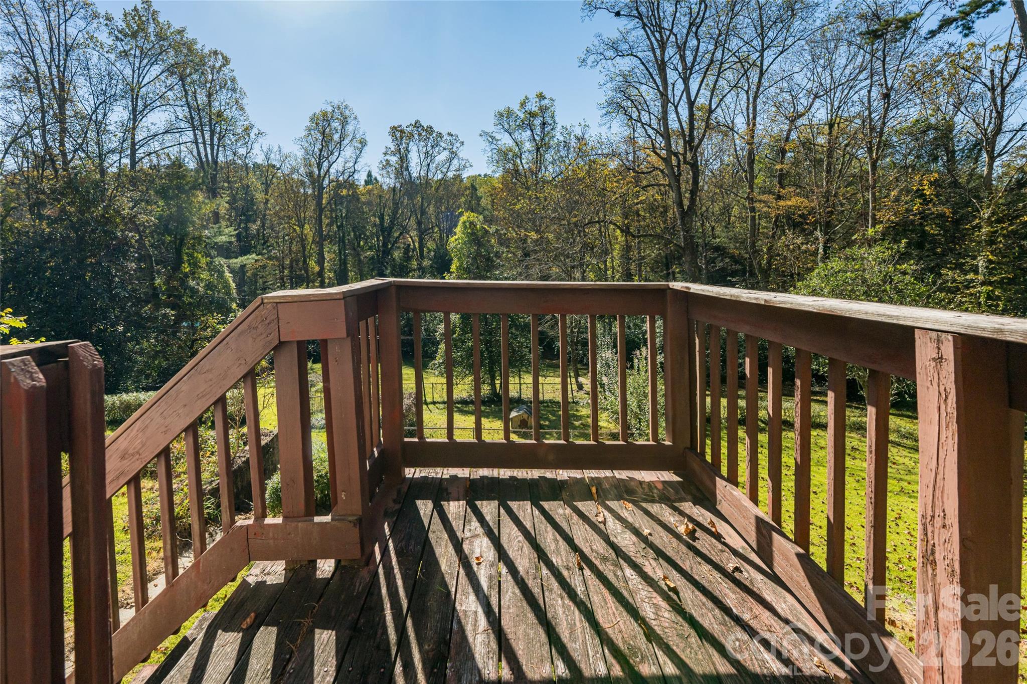 325 Vanderbilt Road Asheville, NC 28803 - Photo 38 of 48 a view of a balcony with wooden floor and fence