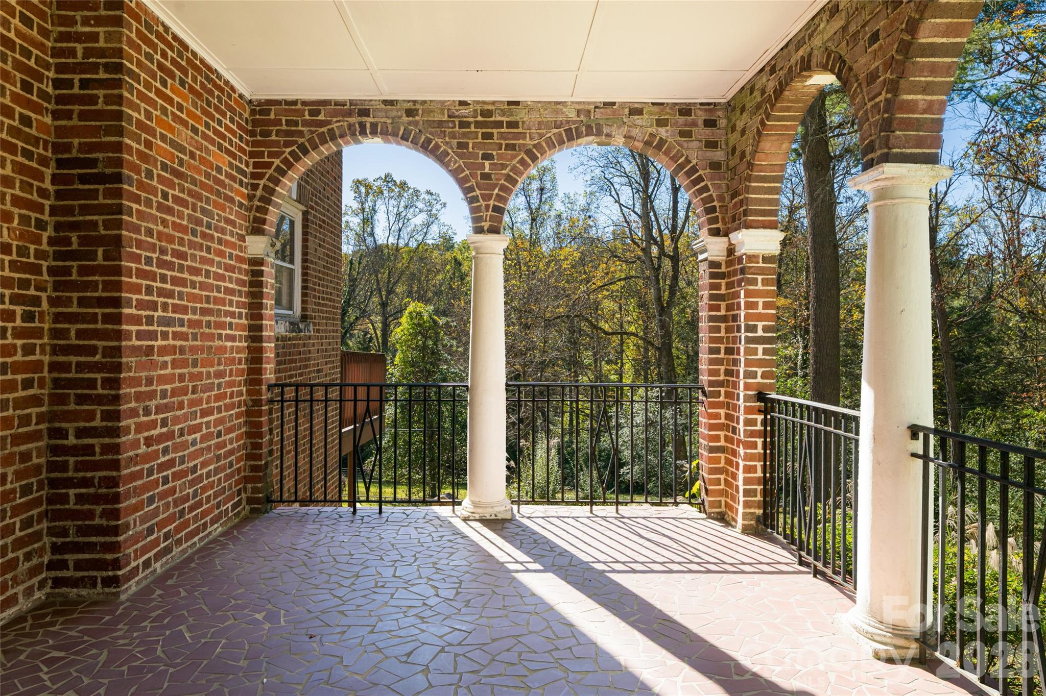 325 Vanderbilt Road Asheville, NC 28803 - Photo 5 of 48 a view of a brick house with a large window