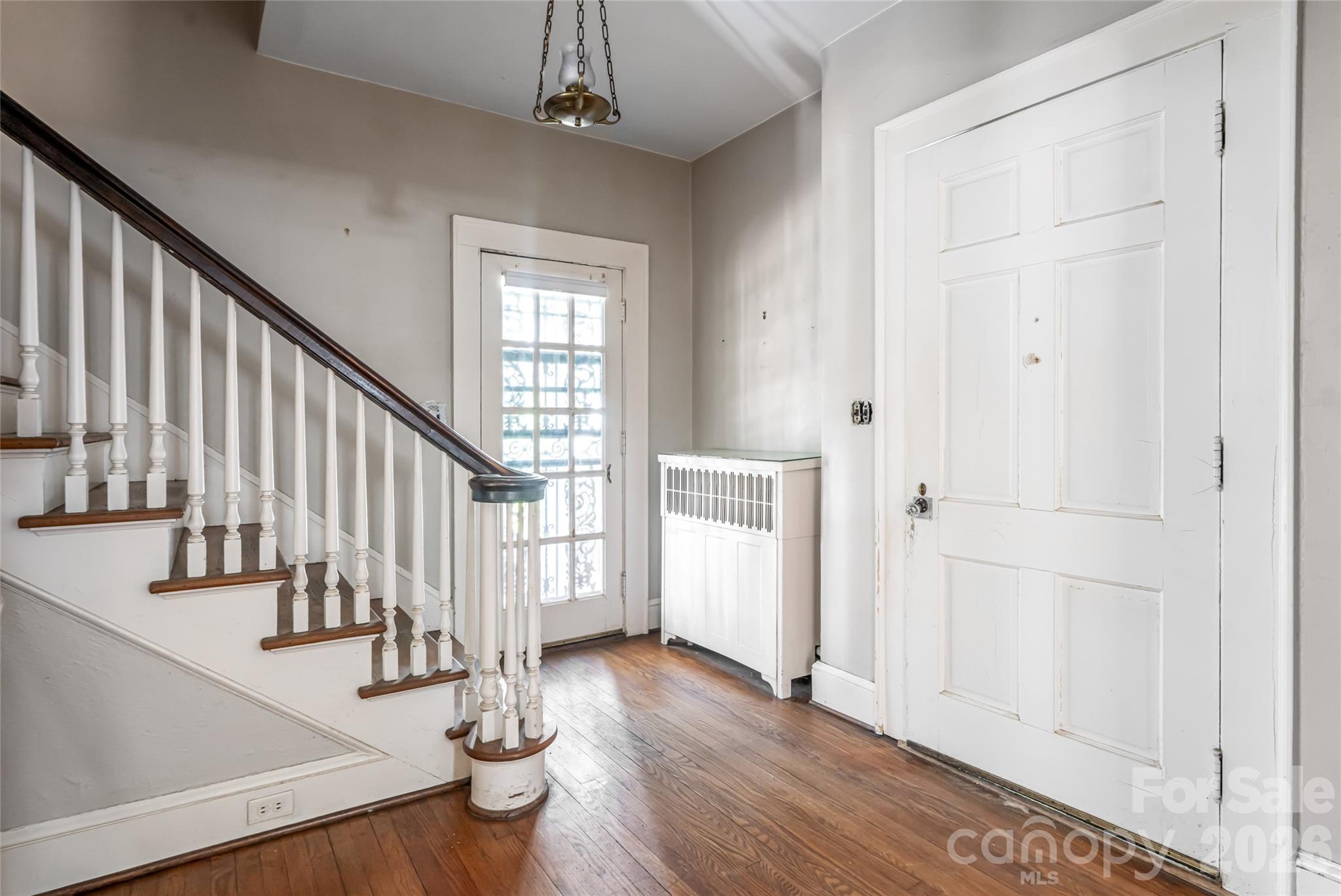 325 Vanderbilt Road Asheville, NC 28803 - Photo 9 of 48 a view of entryway with wooden floor and stairs