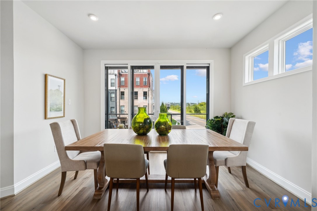 16116 Esteem Way Midlothian, VA 23113 - Photo 15 of 42 a view of a dining room with furniture a potted plant and wooden floor
