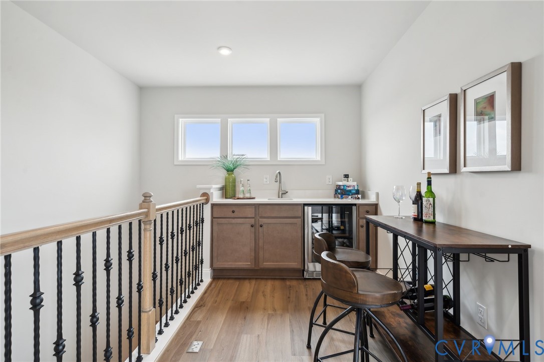 16116 Esteem Way Midlothian, VA 23113 - Photo 29 of 42 a kitchen with sink cabinets and dining table