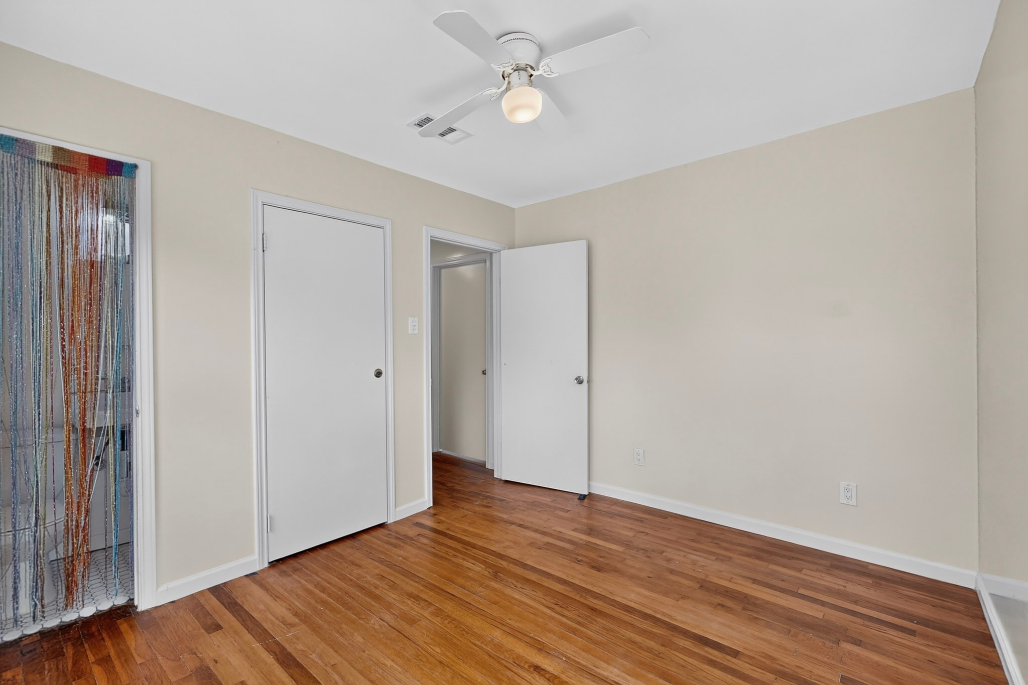 4711 Alf Avenue Austin, TX 78721 - Photo 27 of 34 BR2 - Hardwood flooring, multiple windows for abundant natural light, and a half bath