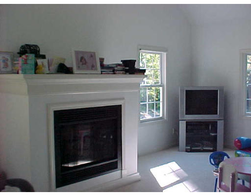10 South Road Sturbridge, MA 01566 - Photo 3 of 8 a living room with furniture a fireplace and a flat screen tv