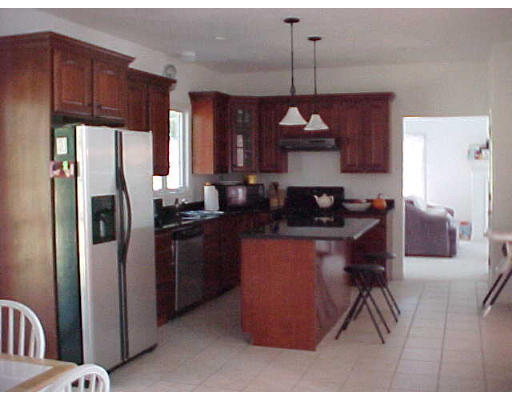10 South Road Sturbridge, MA 01566 - Photo 8 of 8 a kitchen with stainless steel appliances granite countertop a refrigerator a sink dishwasher a stove and a dining table
