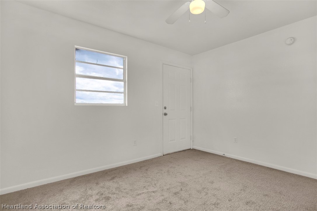 3533 Cemetery Road Sebring, FL 33870 - Photo 12 of 21 a view of an empty room with a window