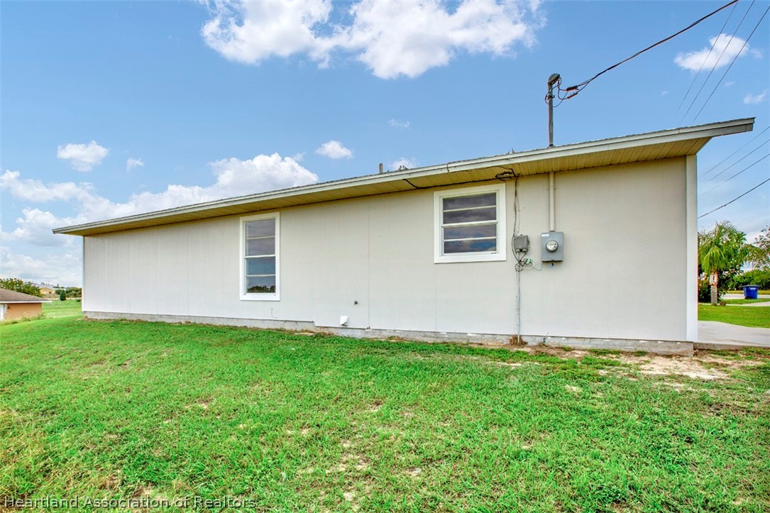 3533 Cemetery Road Sebring, FL 33870 - Photo 20 of 21 a front view of a house with garden