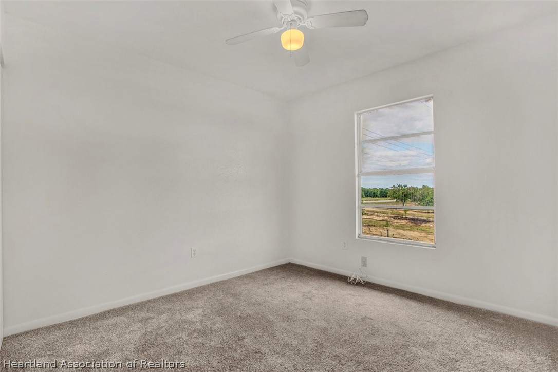 3533 Cemetery Road Sebring, FL 33870 - Photo 5 of 21 a view of an empty room with a window