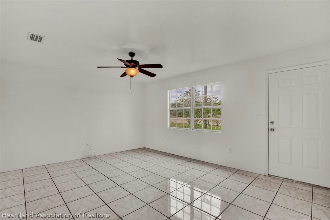 3533 Cemetery Road Sebring, FL 33870 - Photo 7 of 21 a view of an empty room and a window
