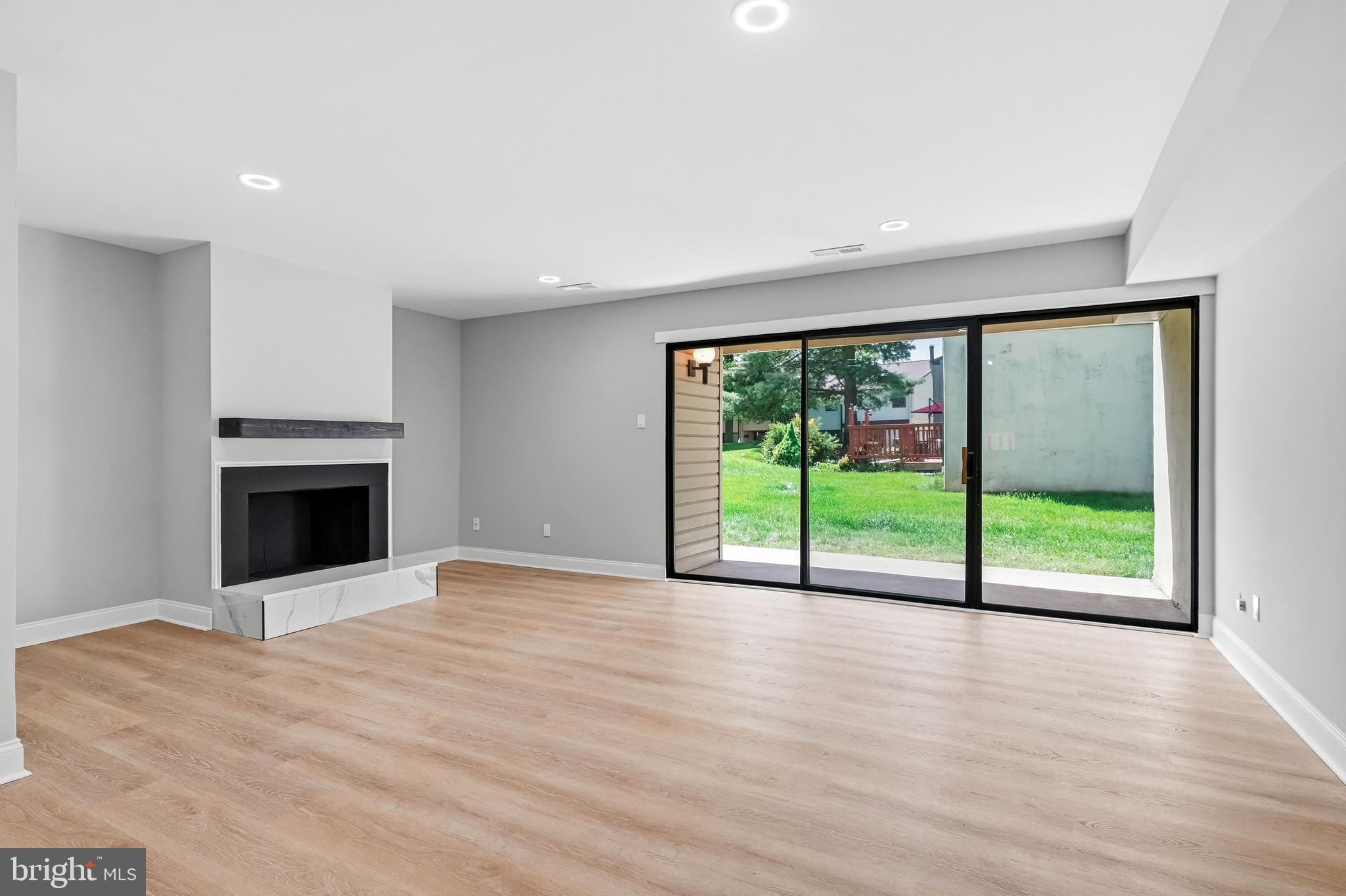 50 Centennial Road Telford, PA 18969 - Photo 6 of 21 Living room with fireplace & sliding doors to back