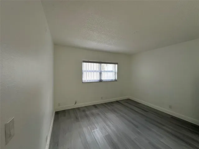 a view of house with swimming pool and porch