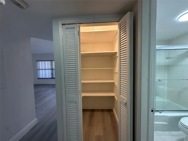 a living room with furniture a rug and a chandelier