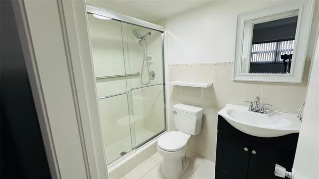 a view of a street with cars on the road