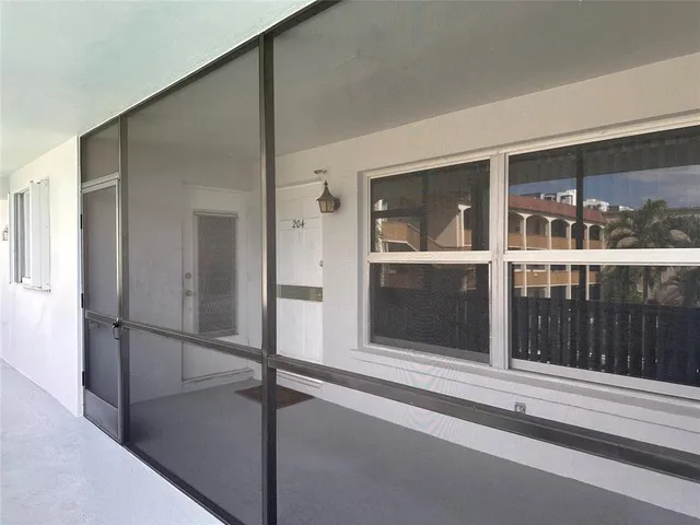 a kitchen with stainless steel appliances granite countertop a sink a stove and a wooden floors