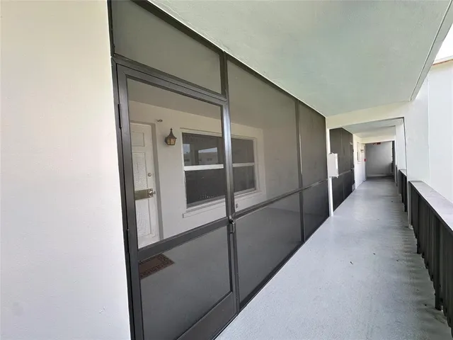 a kitchen with stainless steel appliances granite countertop a refrigerator a stove a sink and a oven