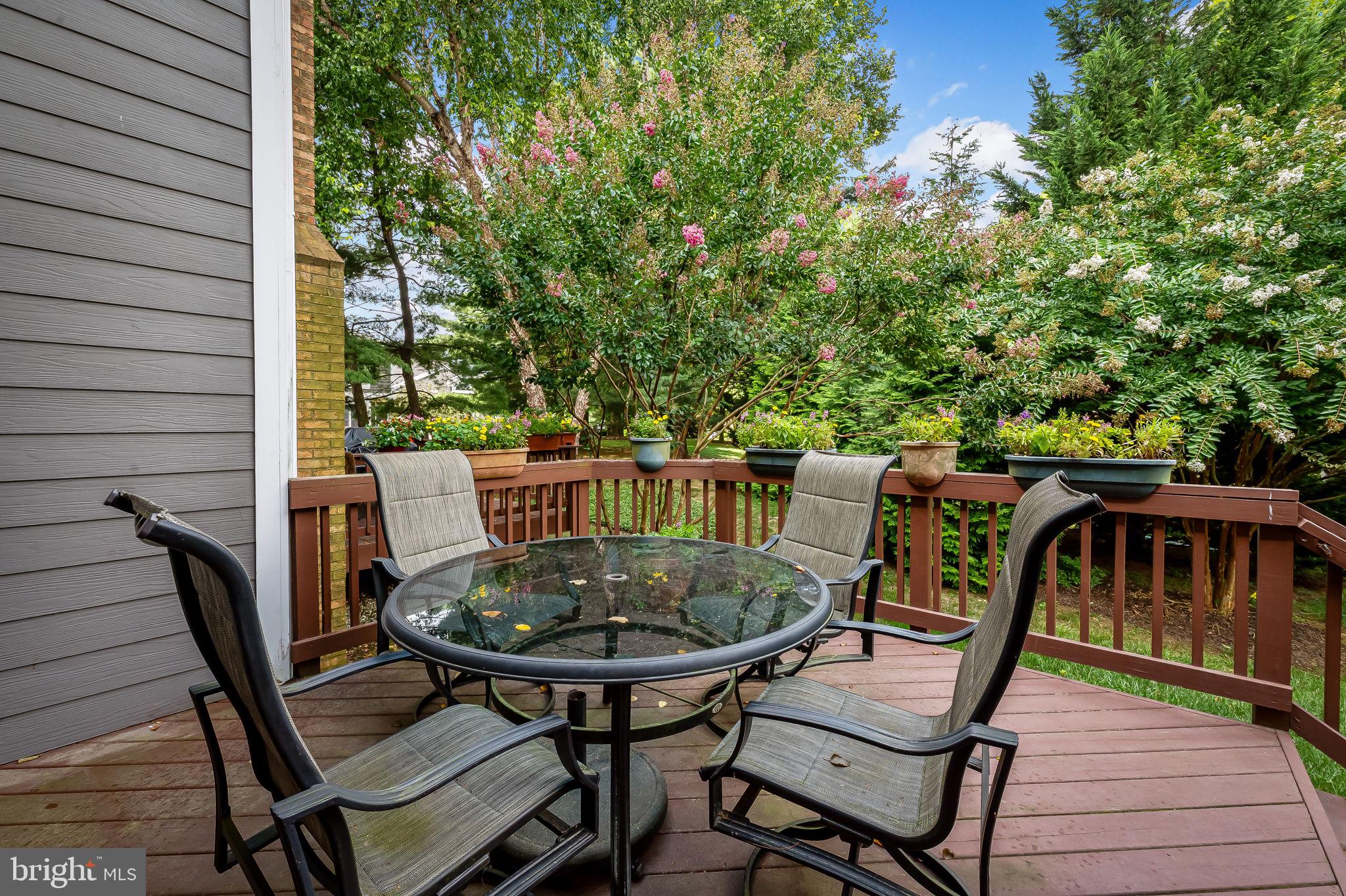 102 River Oaks Circle Baltimore, MD 21208 - Photo 3 of 7 a view of a balcony with table and chairs