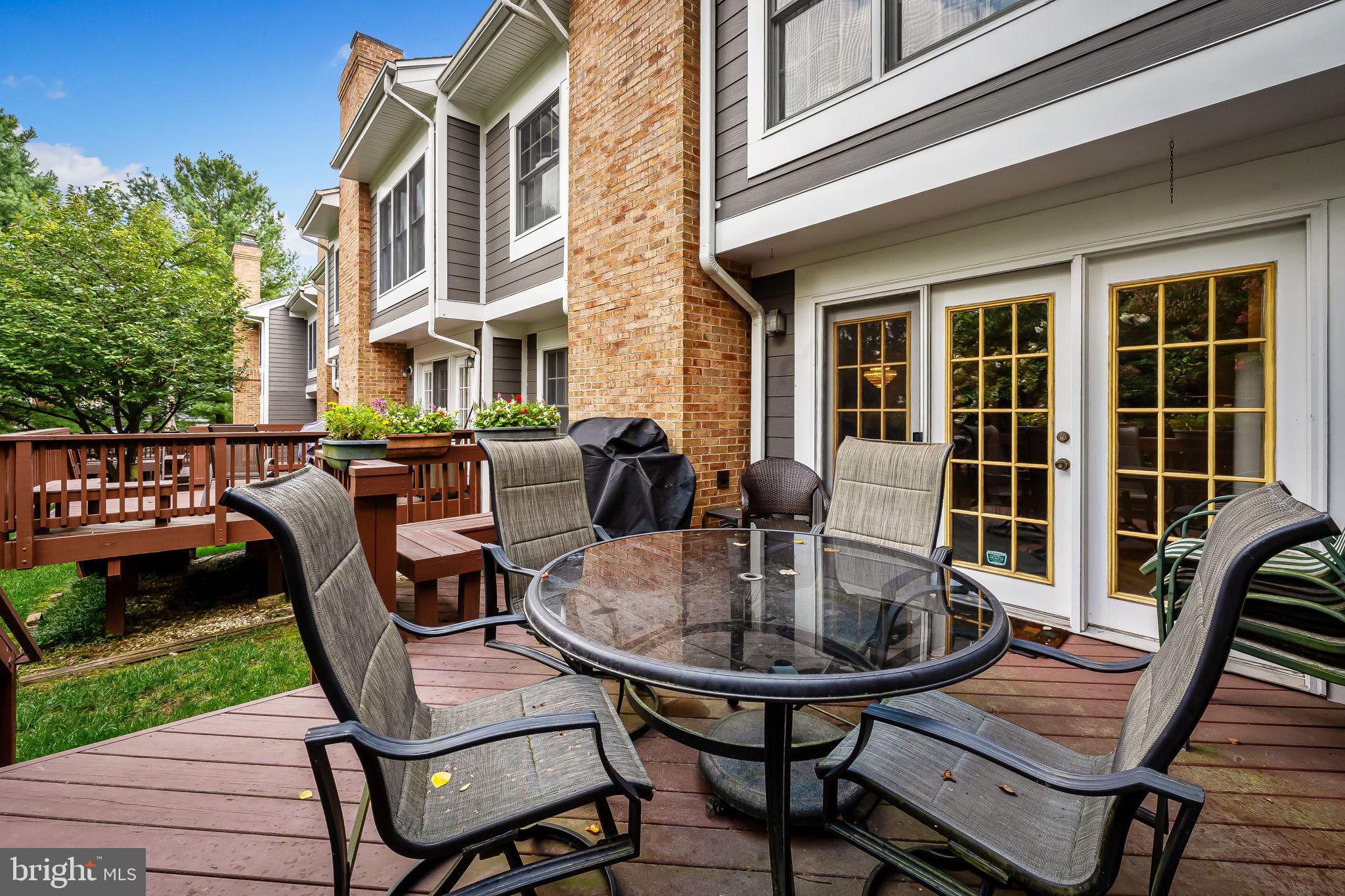 102 River Oaks Circle Baltimore, MD 21208 - Photo 4 of 7 a view of a patio with table and chairs