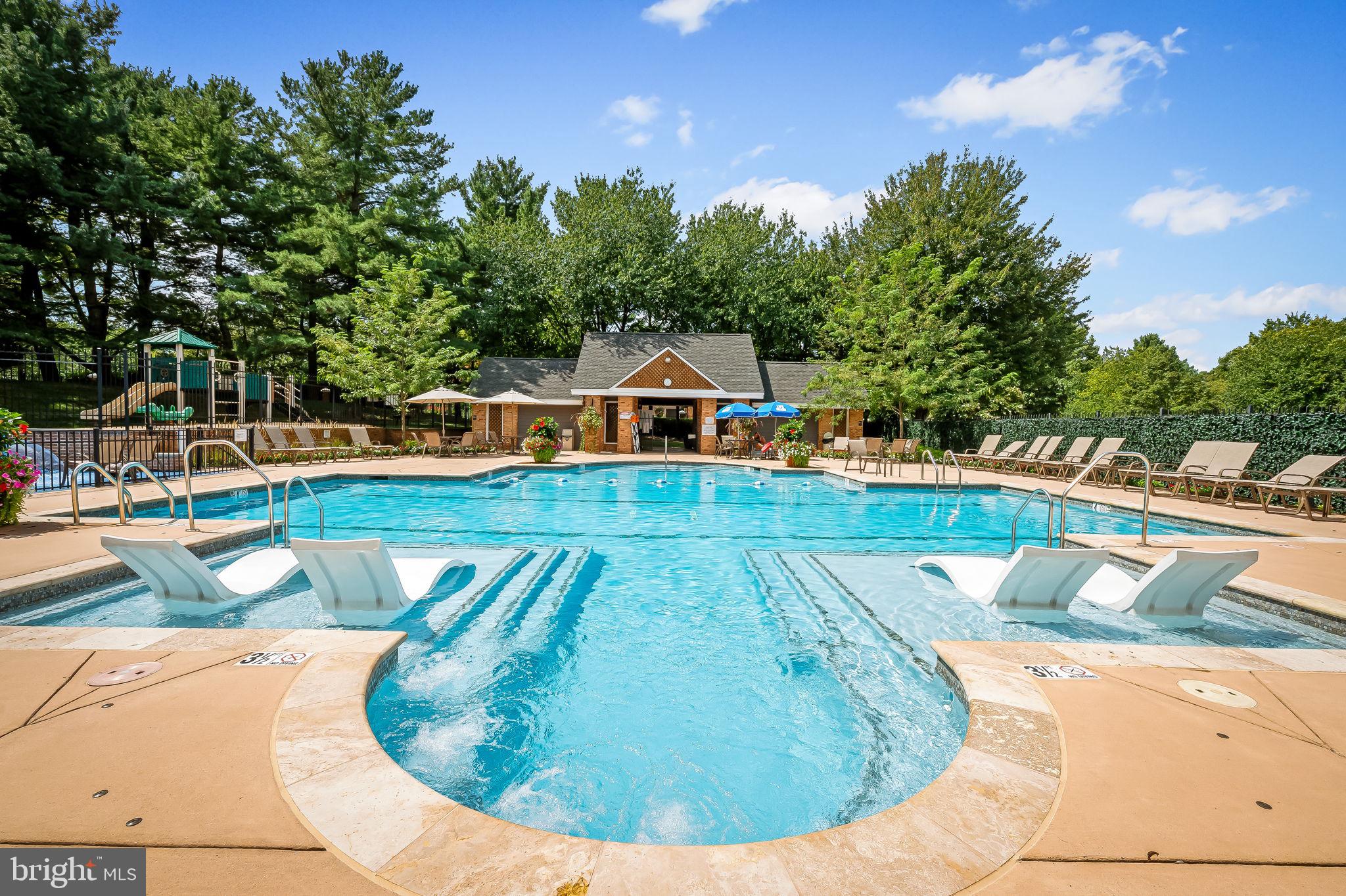 102 River Oaks Circle Baltimore, MD 21208 - Photo 5 of 7 a view of a swimming pool with an outdoor seating