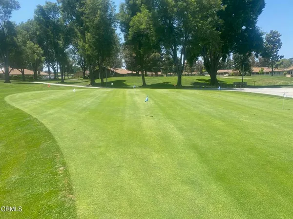a view of a backyard of the house