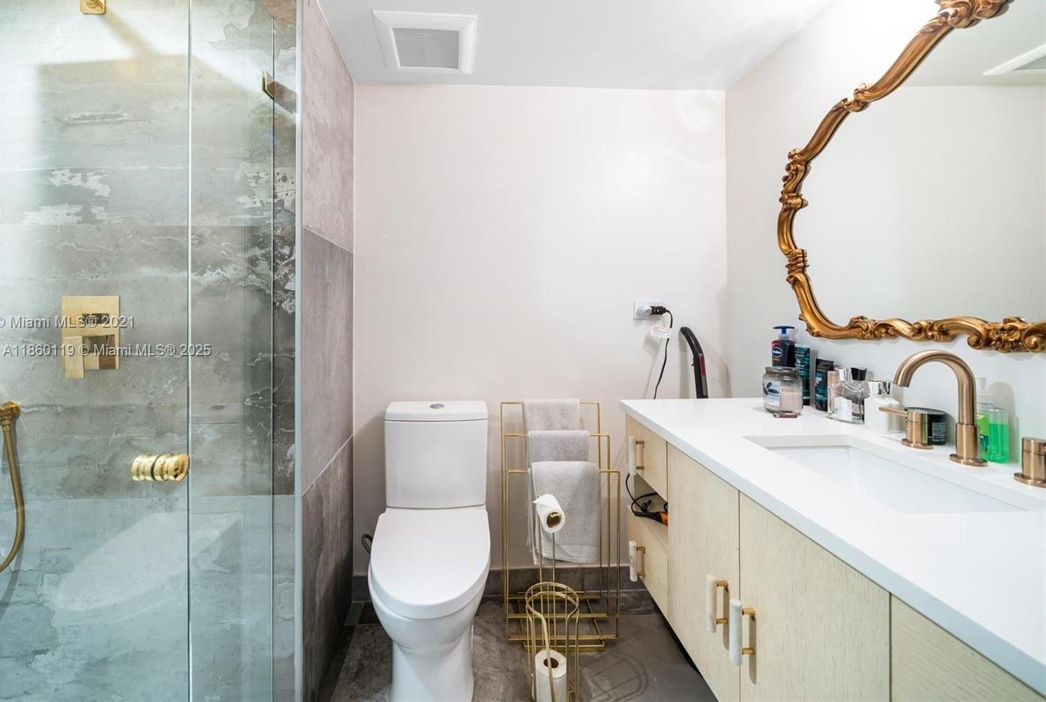 2301 Collins Avenue, Unit 306 Miami Beach, FL 33139 - Photo 13 of 27 a bathroom with a sink toilet and shower