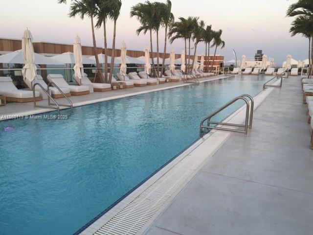 2301 Collins Avenue, Unit 306 Miami Beach, FL 33139 - Photo 22 of 27 swimming view with a outdoor seating space