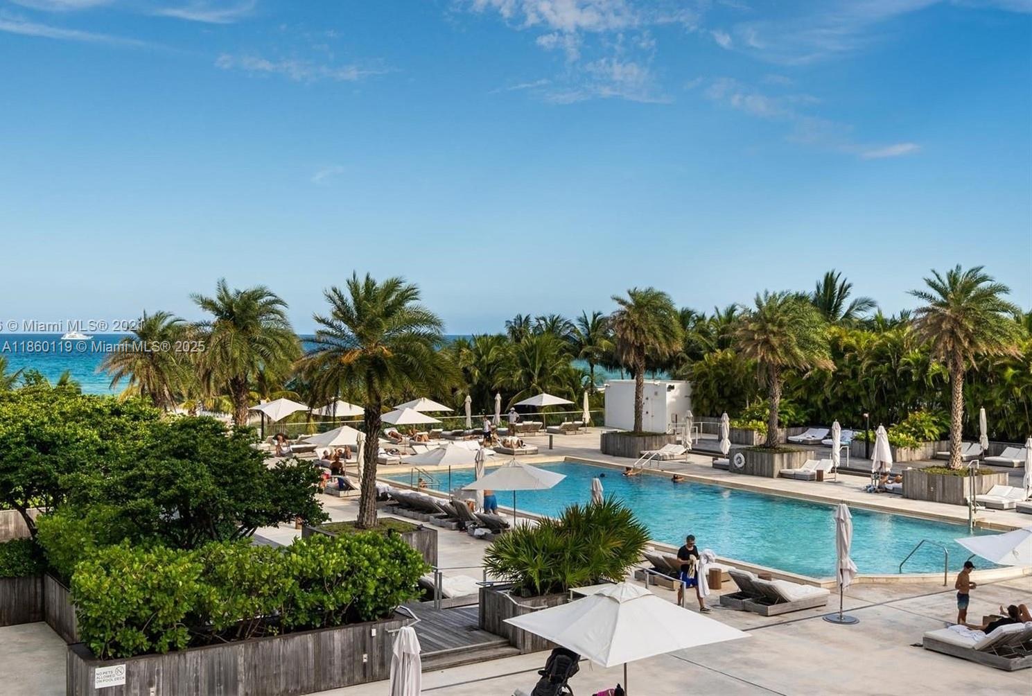 2301 Collins Avenue, Unit 306 Miami Beach, FL 33139 - Photo 26 of 27 a view of swimming pool with outdoor seating and plants