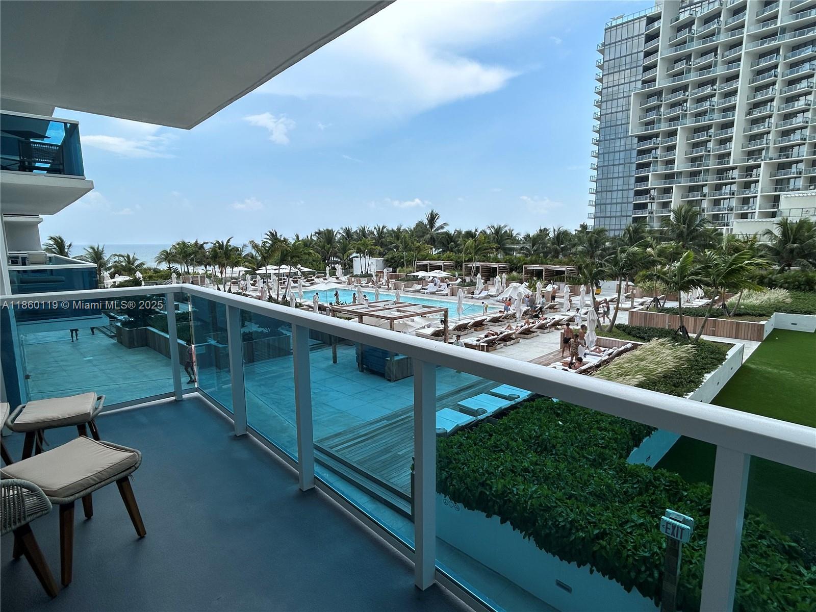 2301 Collins Avenue, Unit 306 Miami Beach, FL 33139 - Photo 4 of 27 a view of swimming pool from a balcony