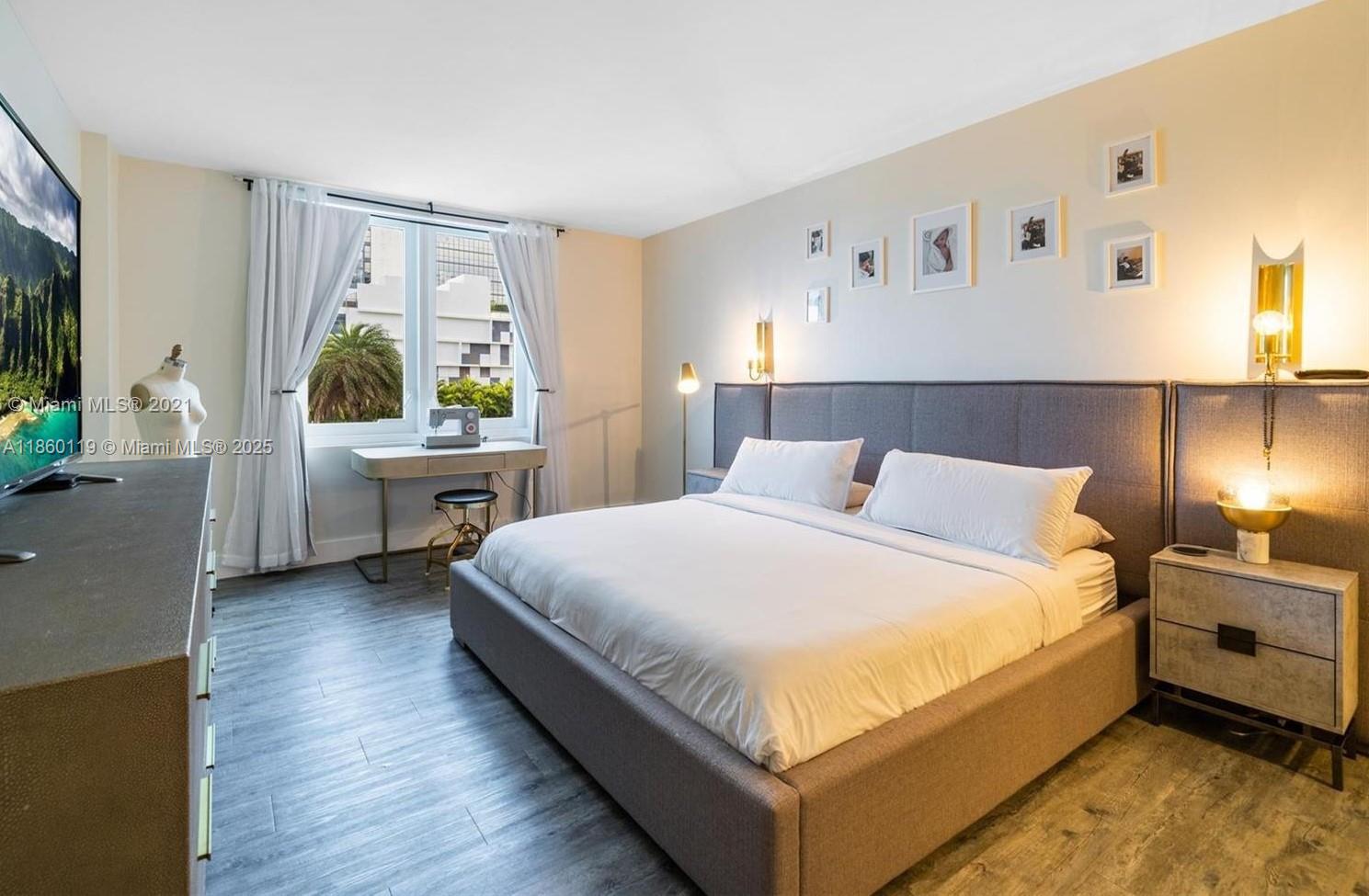 2301 Collins Avenue, Unit 306 Miami Beach, FL 33139 - Photo 5 of 27 a large white bed in a white room