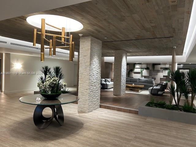 2301 Collins Avenue, Unit 306 Miami Beach, FL 33139 - Photo 7 of 27 a living room with furniture and potted plants