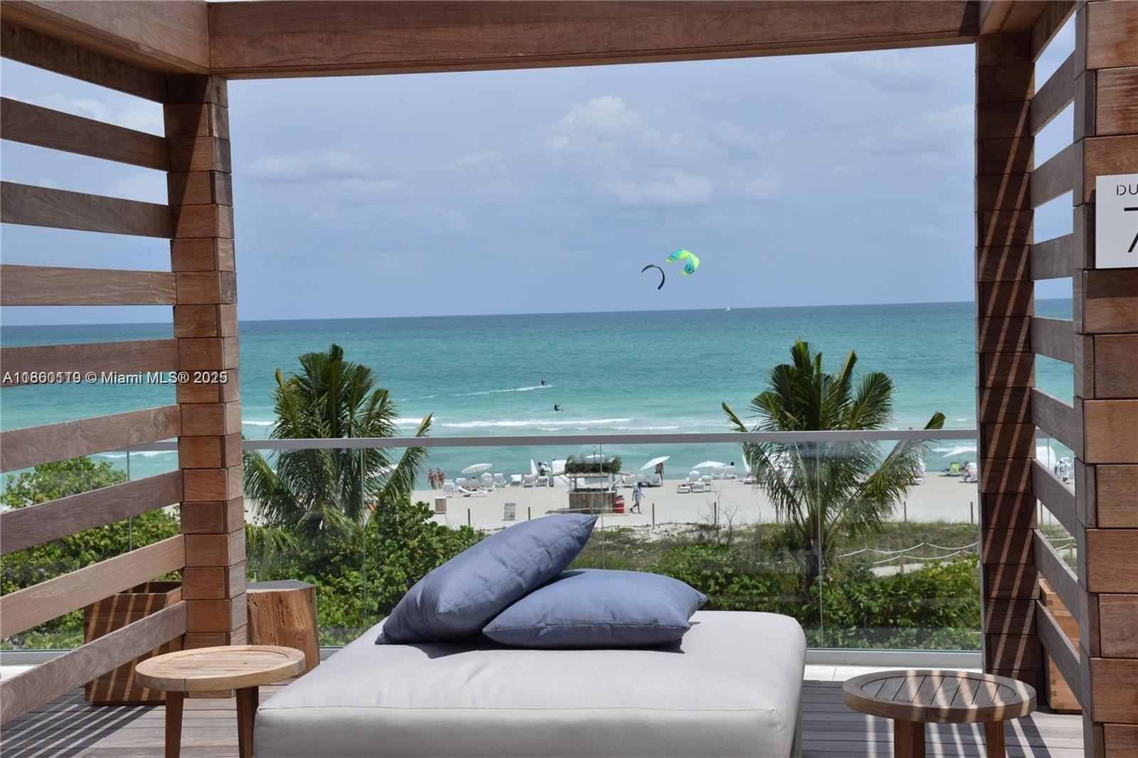 2301 Collins Avenue, Unit 306 Miami Beach, FL 33139 - Photo 10 of 27 a view of a porch with furniture and a potted plant