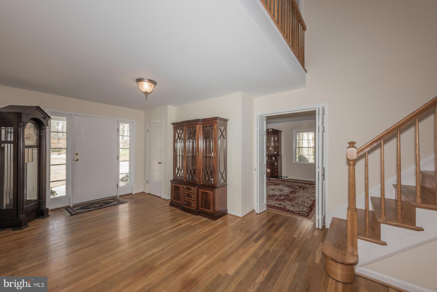 13602 Royal Crest Road Phoenix, MD 21131 - Photo 2 of 29 a view of an empty room with wooden floor and a window