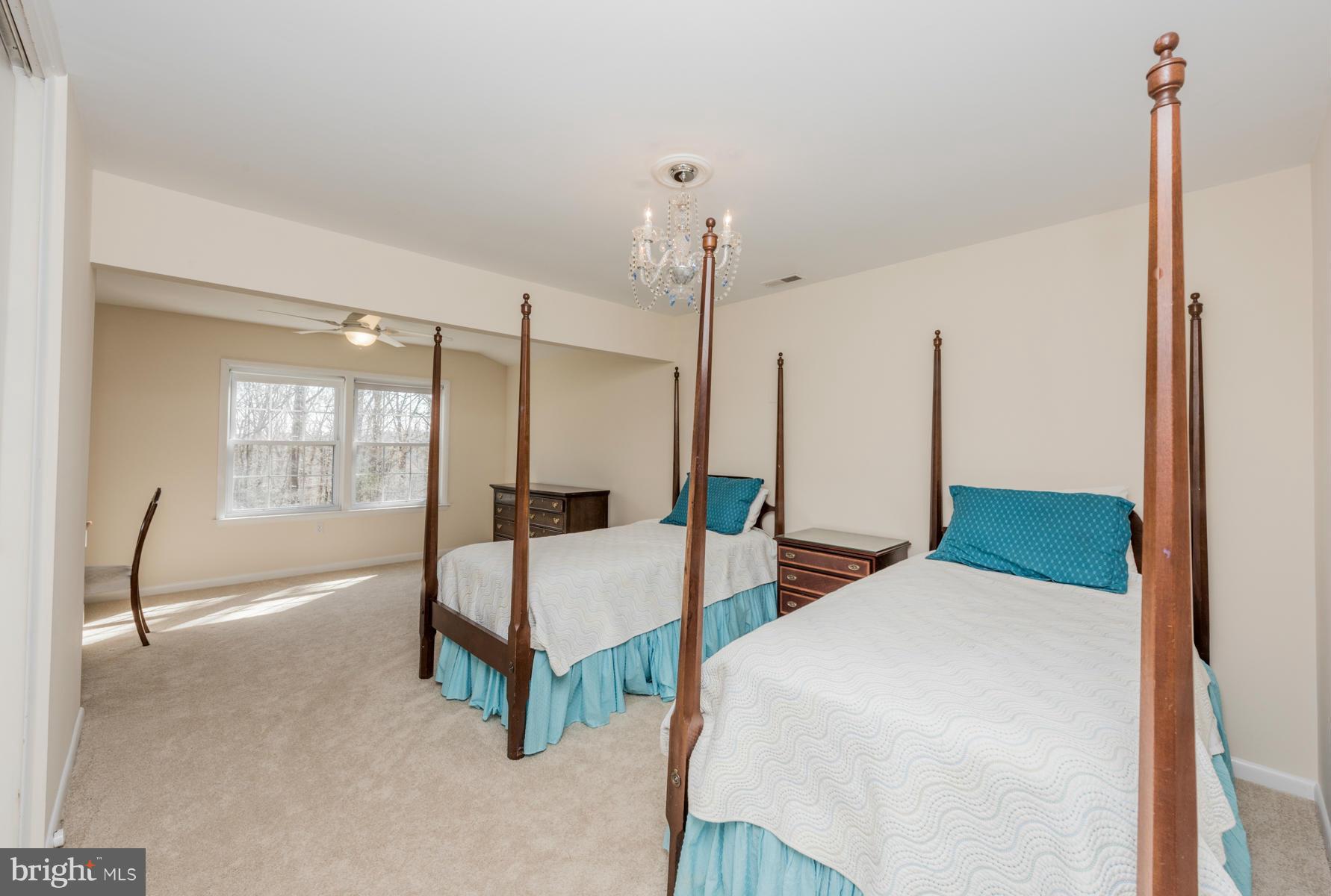 13602 Royal Crest Road Phoenix, MD 21131 - Photo 16 of 29 a bedroom with two beds and large window