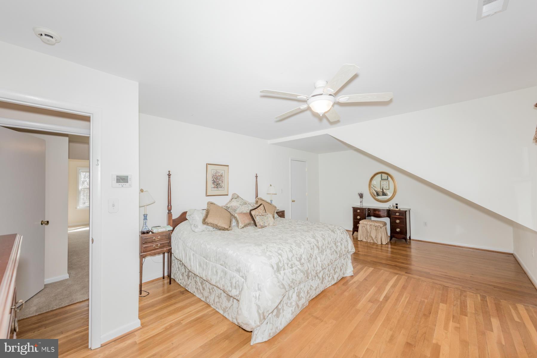13602 Royal Crest Road Phoenix, MD 21131 - Photo 19 of 29 a bedroom with a bed and a ceiling fan