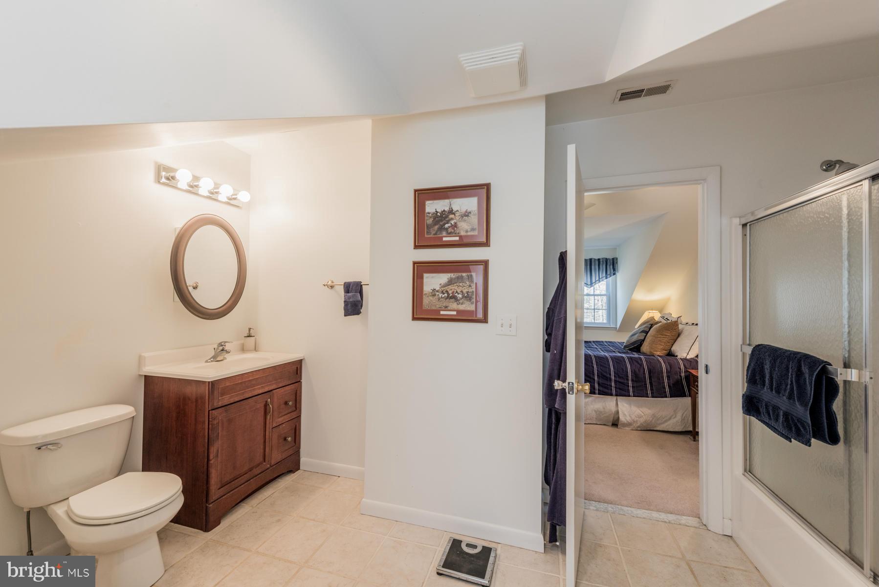 13602 Royal Crest Road Phoenix, MD 21131 - Photo 24 of 29 a bathroom with a toilet sink and mirror